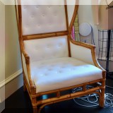F44. Rattan and leather wingback chair. 48”h 